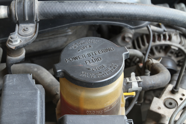 Upclose of vehicle's power steering fluid container