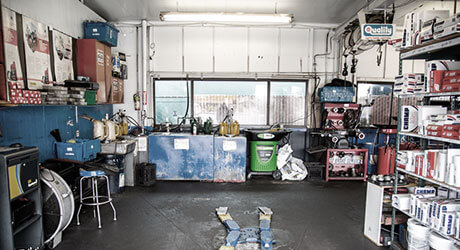 Inside of Quality Tune-Up Car Care garage showing various equipment