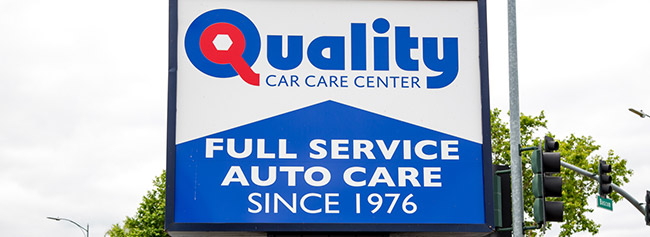 Closeup of sign of shop from outside | Quality Tune-Up Auto Care