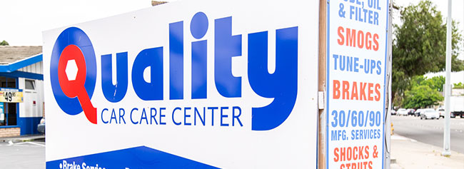 Upclose of outside shop indicating list of services available | Quality Tune-Up Auto Care